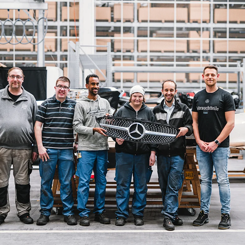 At our Neuhausen auf den Fildern plant, employees with and without disabilities work side by side on a vehicle front — a living example of inclusion and social responsibility in action. 4